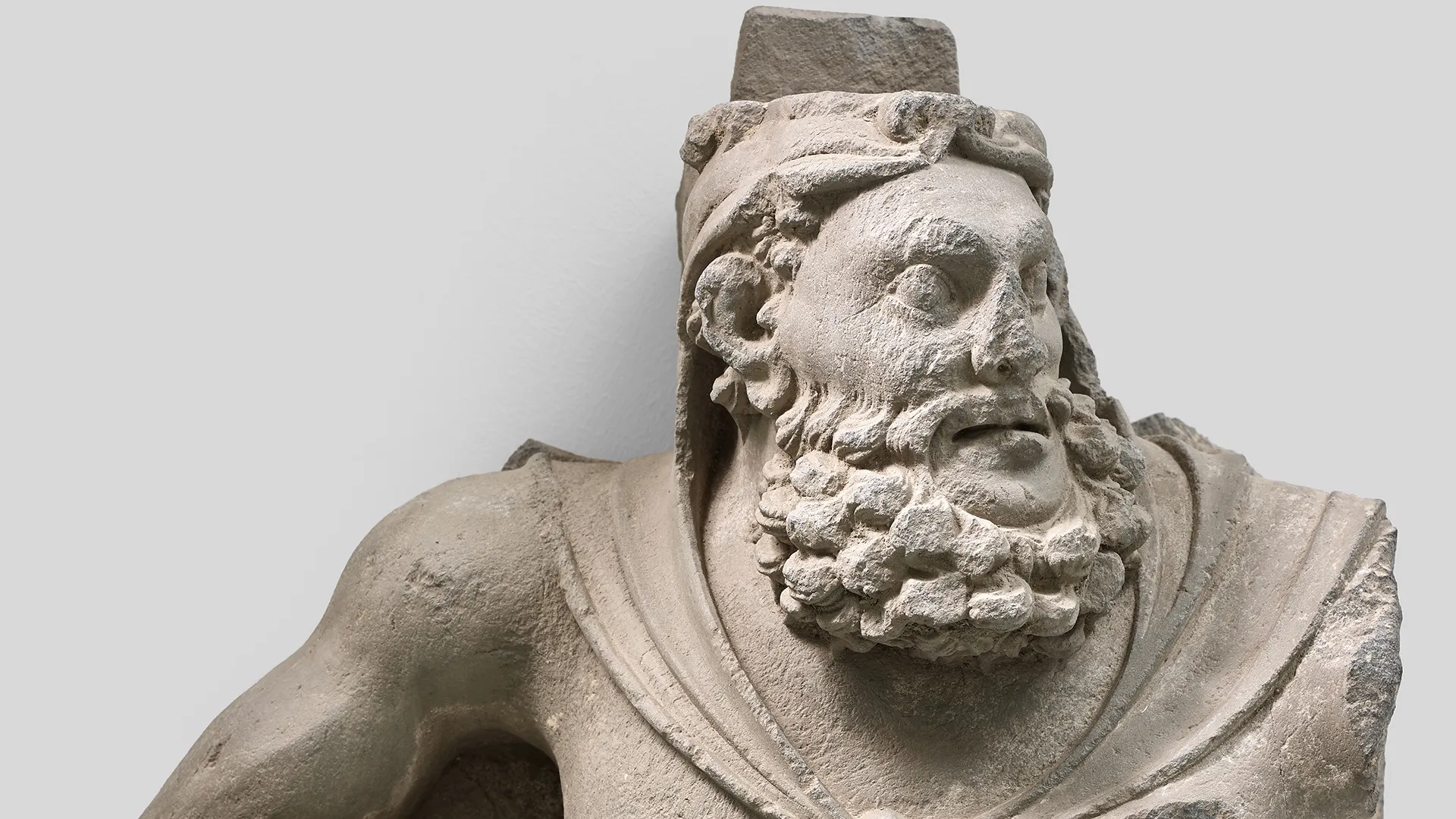 A grey schist figure of Atlas