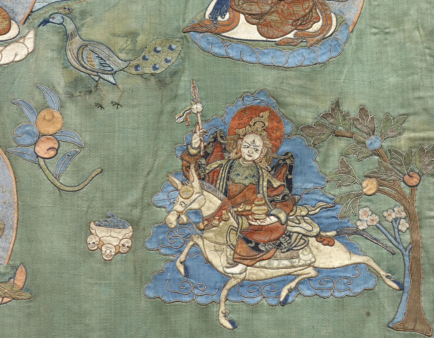 Close up look of : A silk appliqué thangka of Bhaishajyaguru