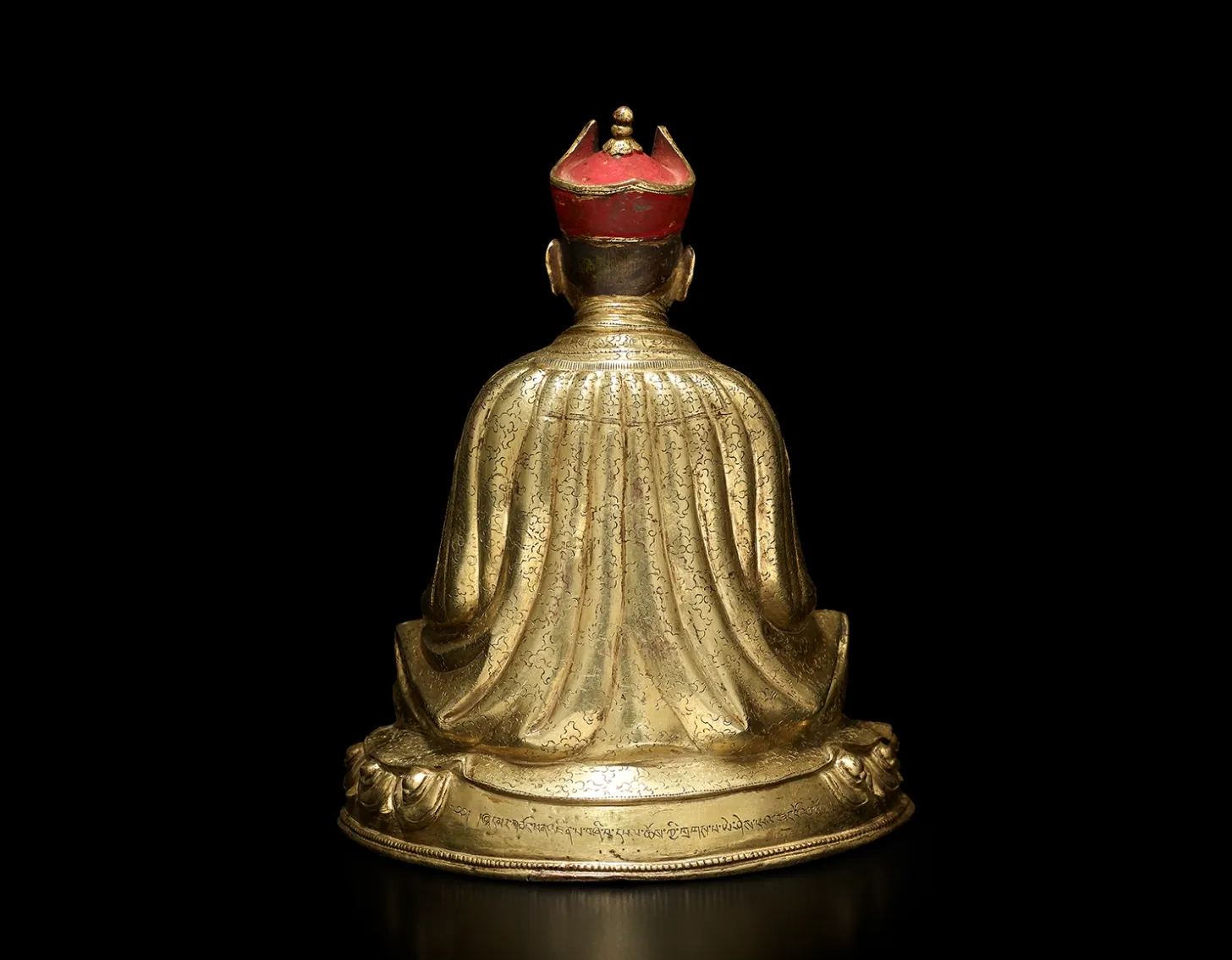 Close up look of : A gilt copper alloy figure of the Fourth Sharmapa, Chokyi Drakpa Yeshe Pal Zangpo