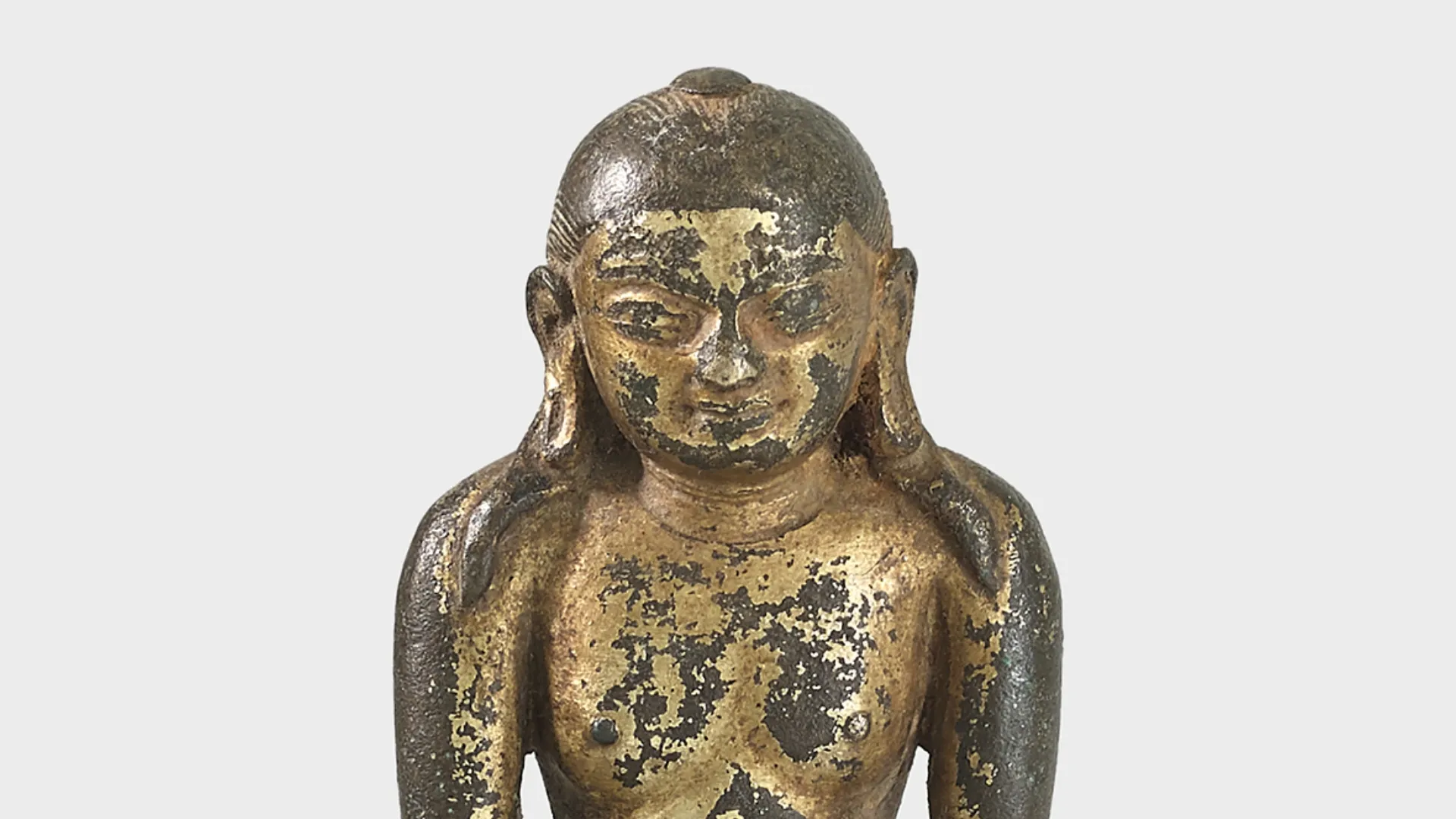 A gilt copper alloy figure of Jina Rishabha