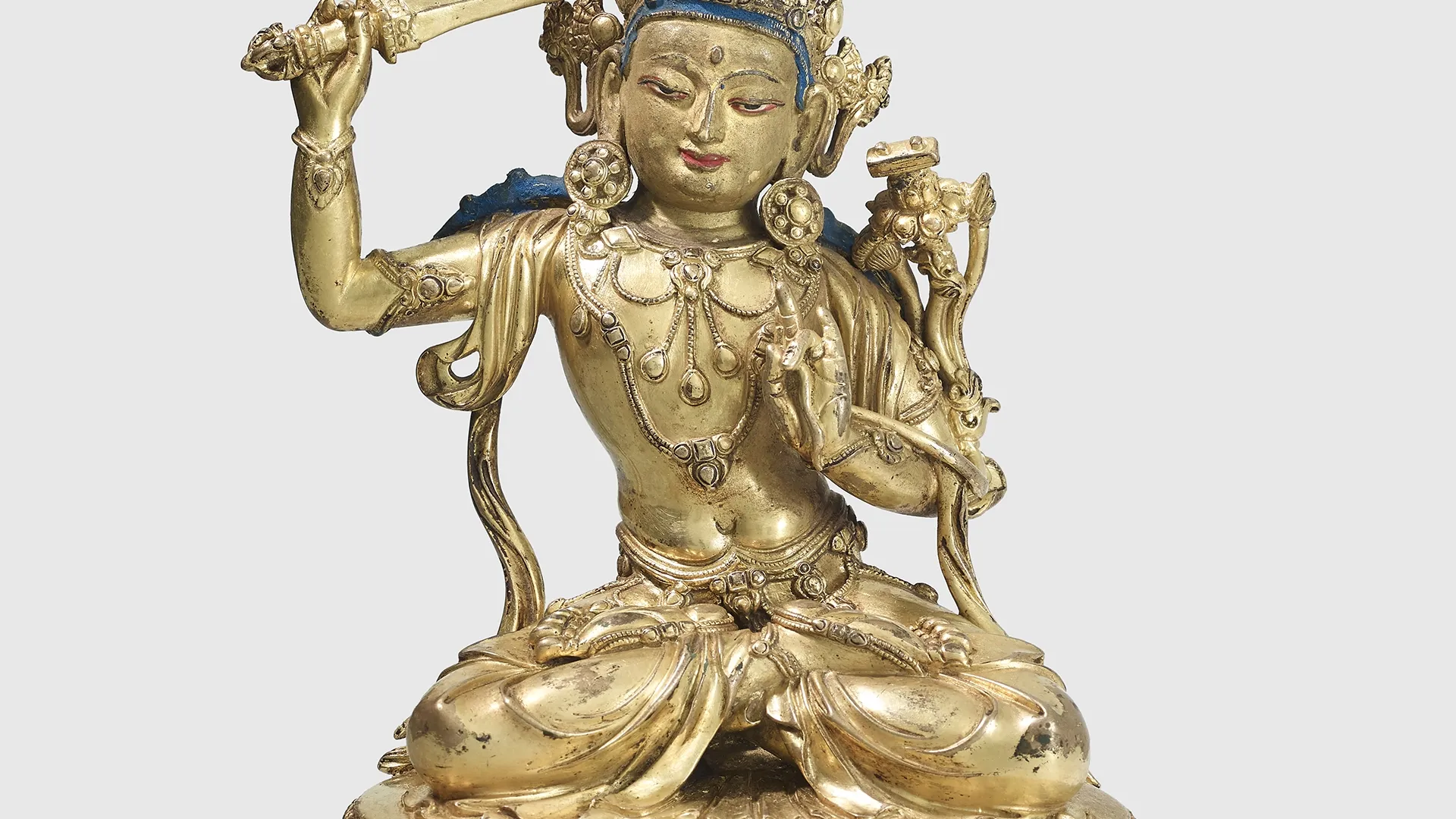 A gilt copper alloy figure of Manjushri