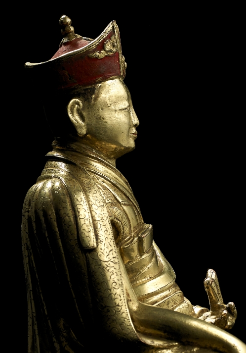 A gilt copper alloy figure of the Fourth Sharmapa, Chokyi Drakpa Yeshe Pal Zangpo