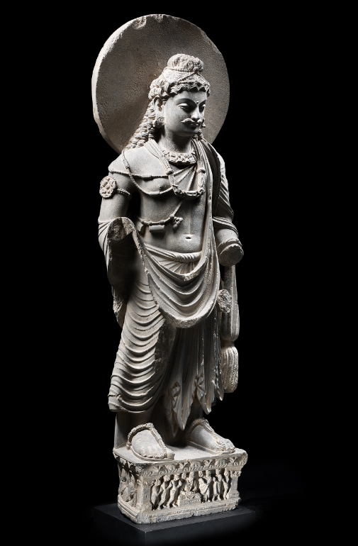 A grey schist figure of Maitreya