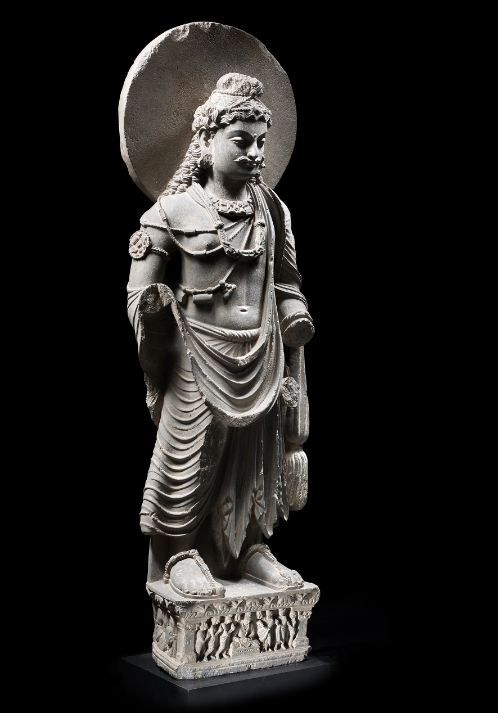 A grey schist figure of Maitreya