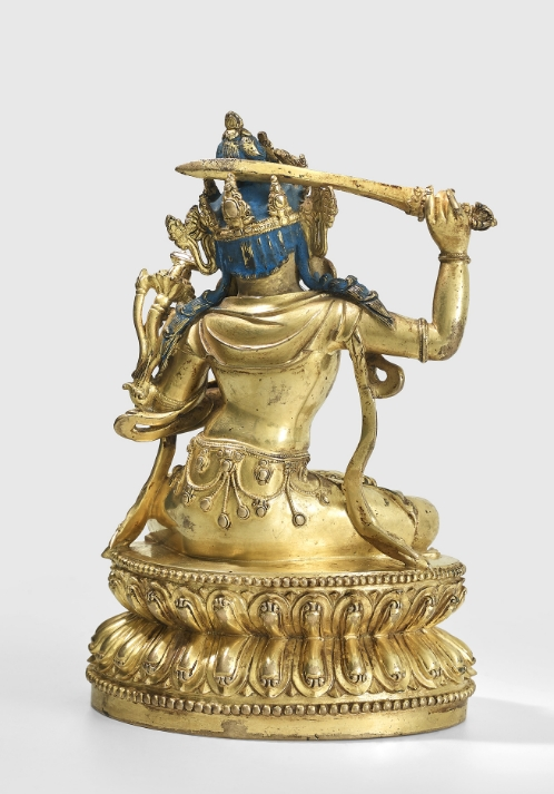 A gilt copper alloy figure of Manjushri